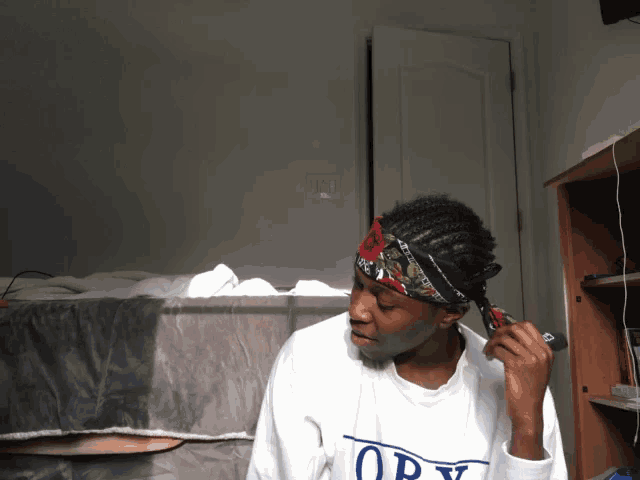 a man wearing a white shirt that says obey