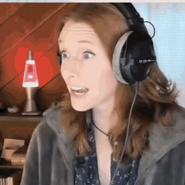 a woman wearing a pair of headphones that says 21700