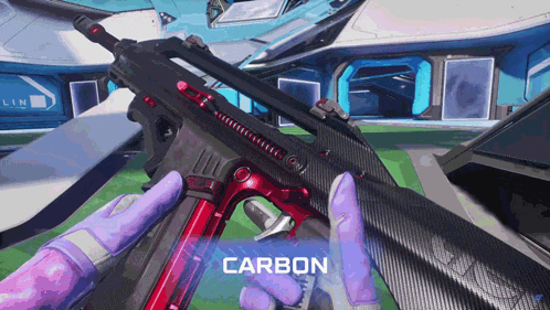 a person in purple gloves is holding a gun with the word carbon on the bottom