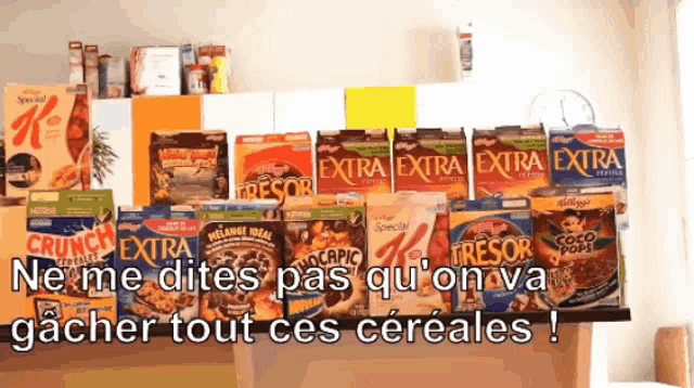 a variety of cereal boxes are lined up on a shelf