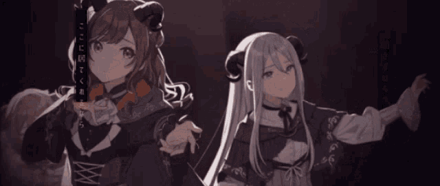 a girl with horns is standing next to another girl with long hair