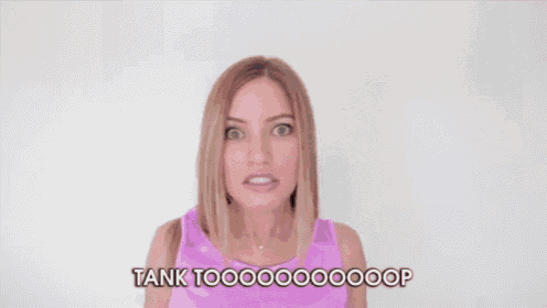 a woman in a pink tank top says tank toooooooooop