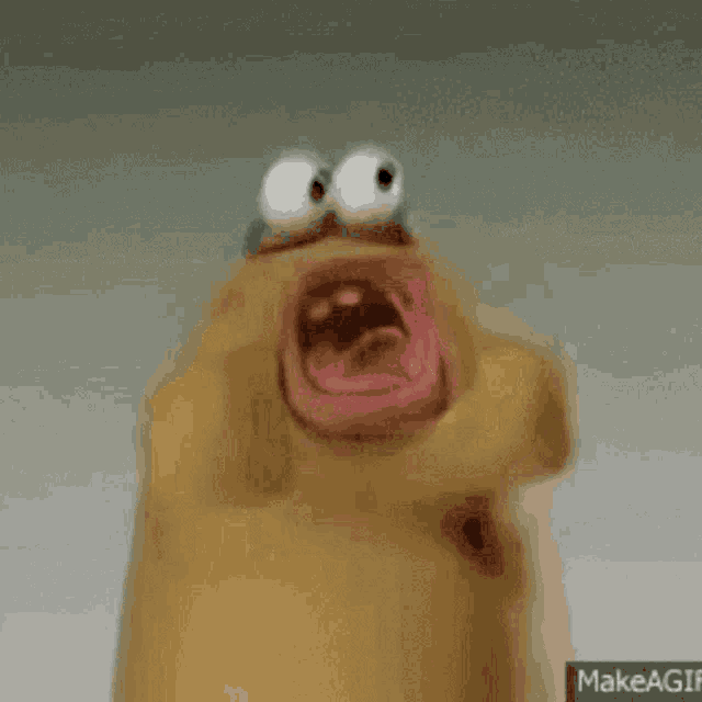 a close up of a cartoon character with a big mouth and big eyes