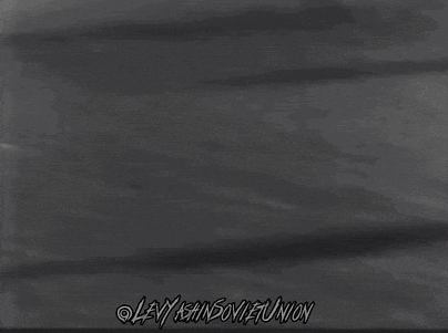 a black and white photo of a soccer game with the words levi ishin soviet union on the bottom right