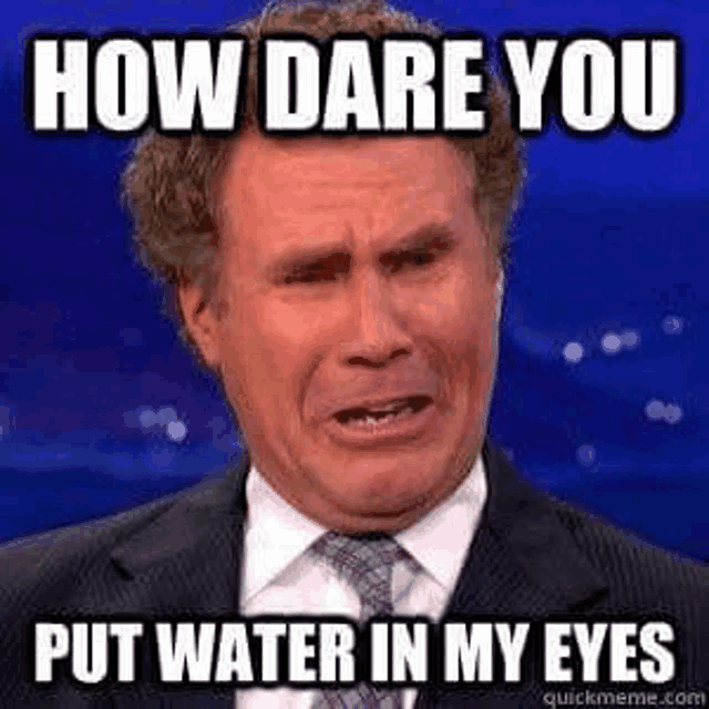 a man in a suit and tie is making a funny face while talking about how dare you put water in my eyes .