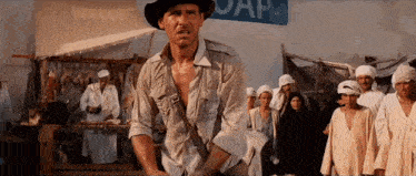 a man in a hat is standing in front of a sign that says soap