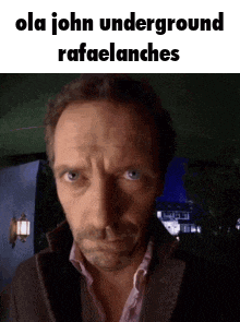 a close up of a man 's face with a caption that says ola john underground rafaelanchies