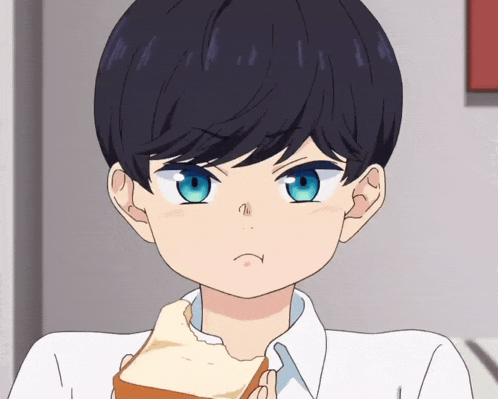 a boy with blue eyes is eating a piece of toast