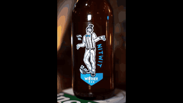 a bottle of witbier xxx with a man on the label