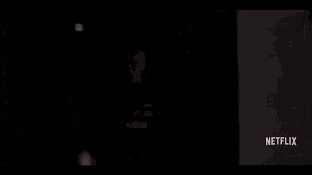 ariana grande is wearing a ponytail and a choker in a netflix ad .
