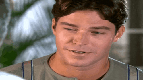 a close up of a man 's face with his mouth open