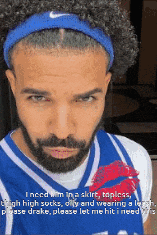 a man with a beard is wearing a nike headband and a basketball jersey