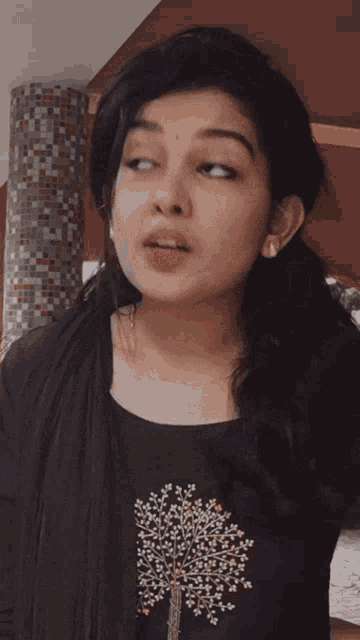 a close up of a woman making a funny face with her mouth open