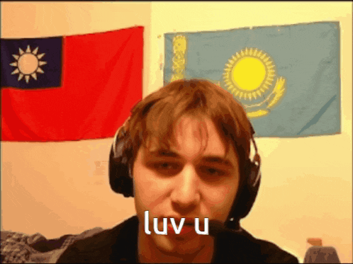a man wearing headphones and a microphone says luv u
