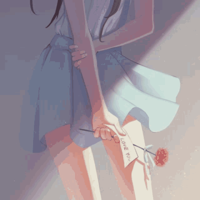 a girl in a blue dress is holding a card that says " love you "