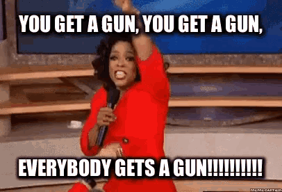 oprah winfrey is holding a microphone and saying you get a gun , you get a gun
