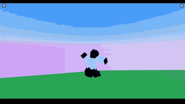 a person in a blue and white striped shirt is kneeling in a field