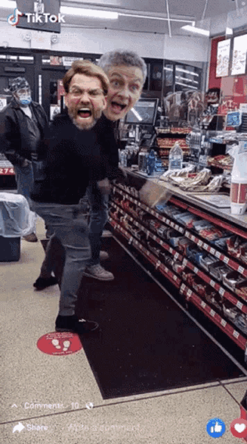 a man with a mask on his face is standing in front of a counter in a store