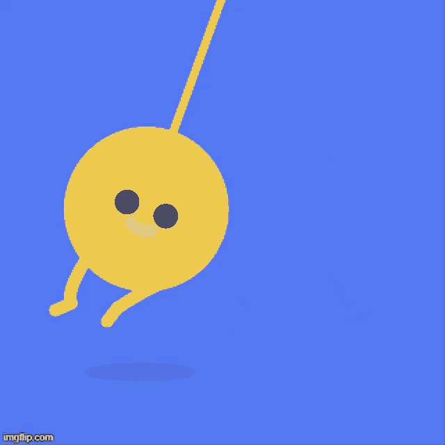 a yellow circle with arms and legs is hanging from a string