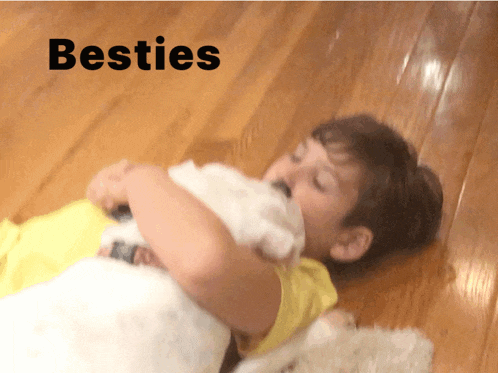 a child laying on the floor with the word besties written above him