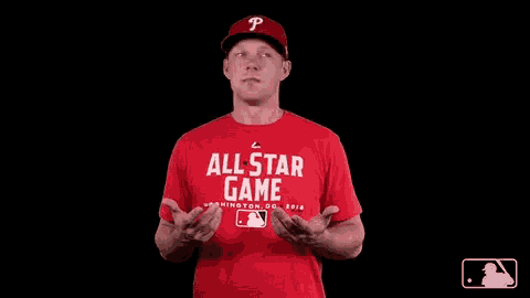a man in a red all star game shirt