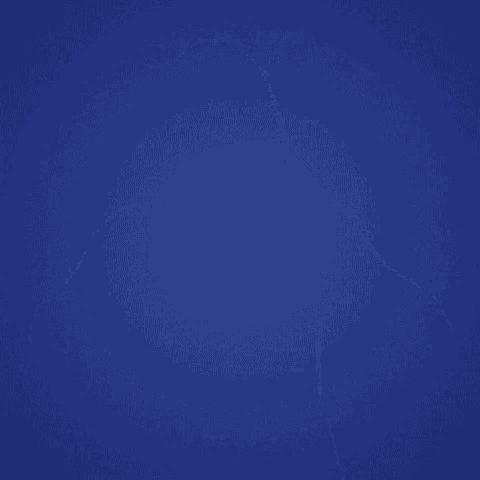 a woman in a white shirt is smiling with her hands on her hips against a blue background