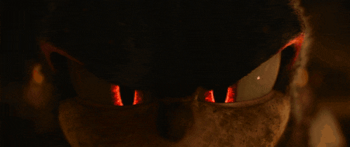 a close up of a sonic the hedgehog 's eyes with fire coming out of them .