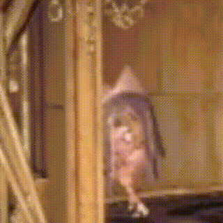 a blurred image of a person standing in a room with a mirror .