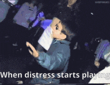 a cartoon of a boy dancing with the words " when distress starts playing " below him