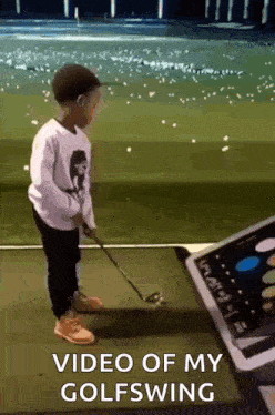 a young boy is playing golf with a video of his golf swing in the background