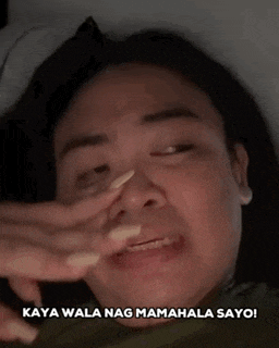 a close up of a person 's face with the words kaya wala nag mamahala sayo