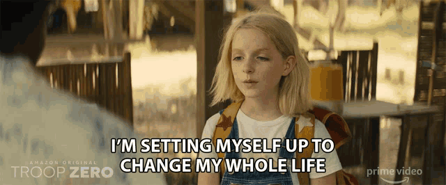a girl in overalls is saying i 'm setting myself up to change my whole life