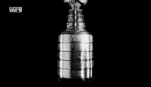 a close up of a trophy on a black background .