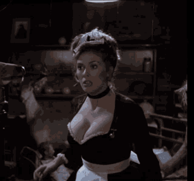 a woman with a very large breast is in a room