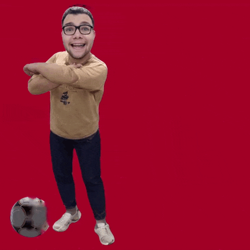a man standing next to a soccer ball with bora jogar written on the top