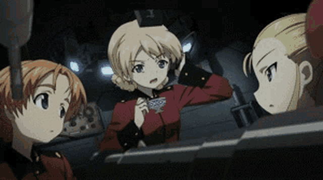 a group of anime girls are looking at something in a dark room