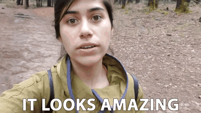 a woman taking a selfie in the woods with the words it looks amazing below her