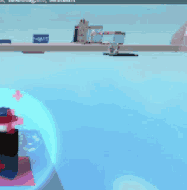 a blurred image of a person in a bubble with a red cross in the background