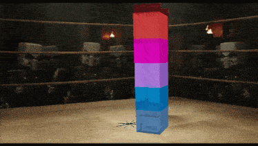 a stack of blocks in a boxing ring one of which says ' j-box ' on it