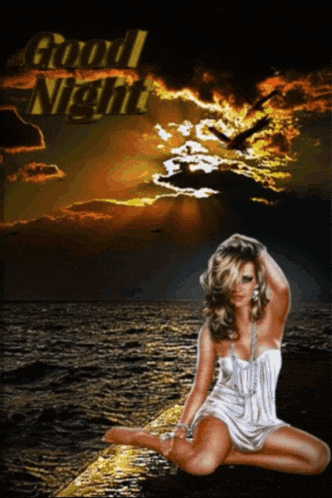 a woman in a white dress is kneeling on a beach with the words good night written above her