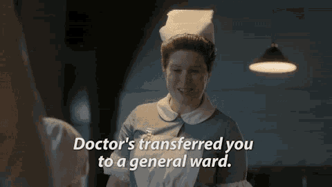 a nurse is talking to another nurse in a hospital room .