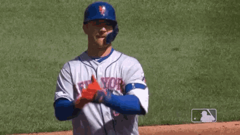 a baseball player wearing a new york jersey is throwing a baseball .