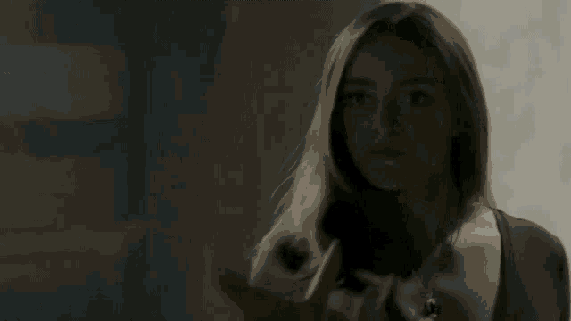 a man and a woman are dancing together in a dark room .