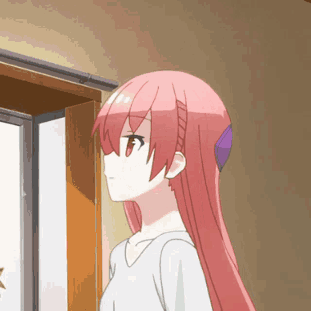 a girl with pink hair is standing in front of a window looking out