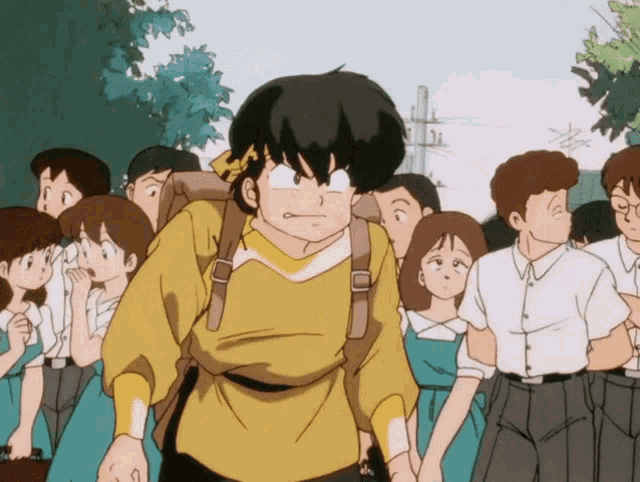 a boy in a yellow shirt is walking through a crowd