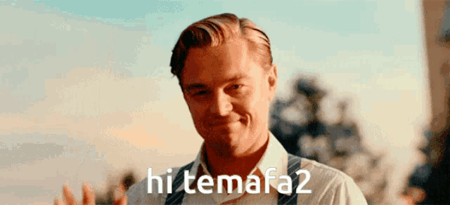 a man in a white shirt and suspenders is smiling with the words hi temafa2 behind him