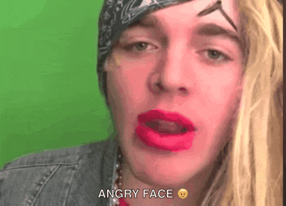 a man with a bandana on his head has red lipstick on his lips and the words angry face below him