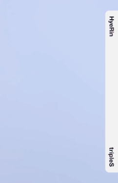 a girl in a white shirt is holding a white sweater with the word triples on it