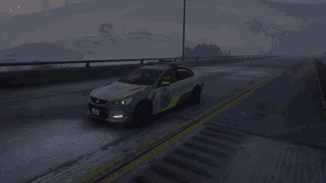 a blue and yellow state highway patrol car