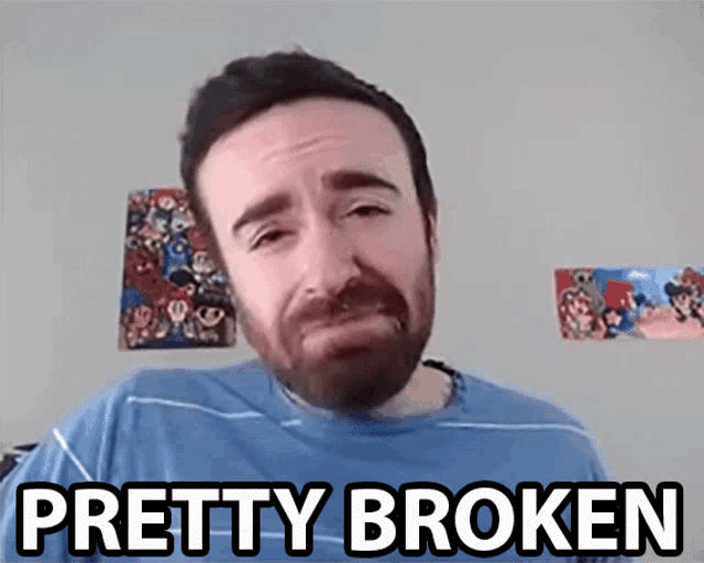 a man with a beard is crying with the words " pretty broken " below him